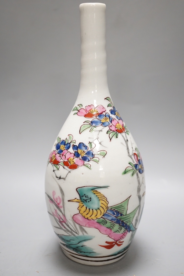 A 19th century Chinese blue and white 'prunus' vase, a Chinese green glazed jar, a japanese vase and two dishes and two Canton famille rose plates (7)
